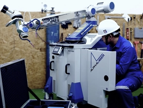 DSI technician inspecting an ALM300 Pulse Laser Welder for repair