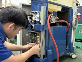 DSI technician performing root cause analysis on a machine control panel