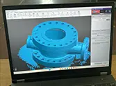 3D scan data of the valve body flange displayed on a laptop