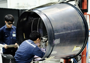 DSI technician performing Pulse Laser Welding on an aircraft engine duct