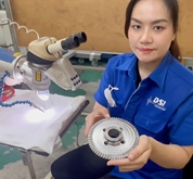 DSI technician holding a Pulse Laser Welded gear component