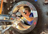 DSI technician performing Pulse Laser Welding on a large flange