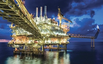 Offshore oil and gas platform at dusk